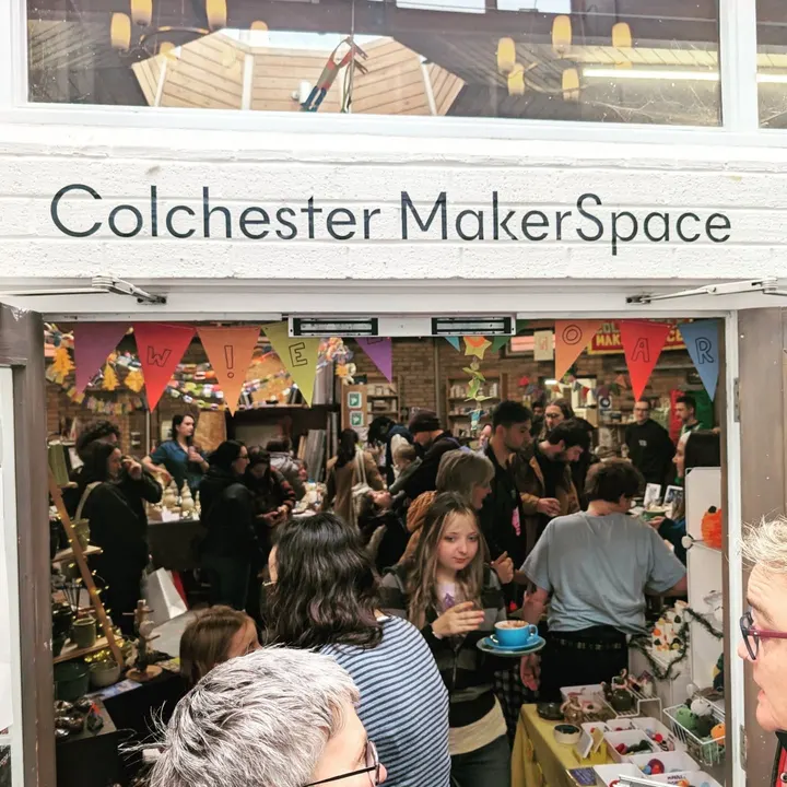 A packed Colchester Makerspace market, seen through the front door